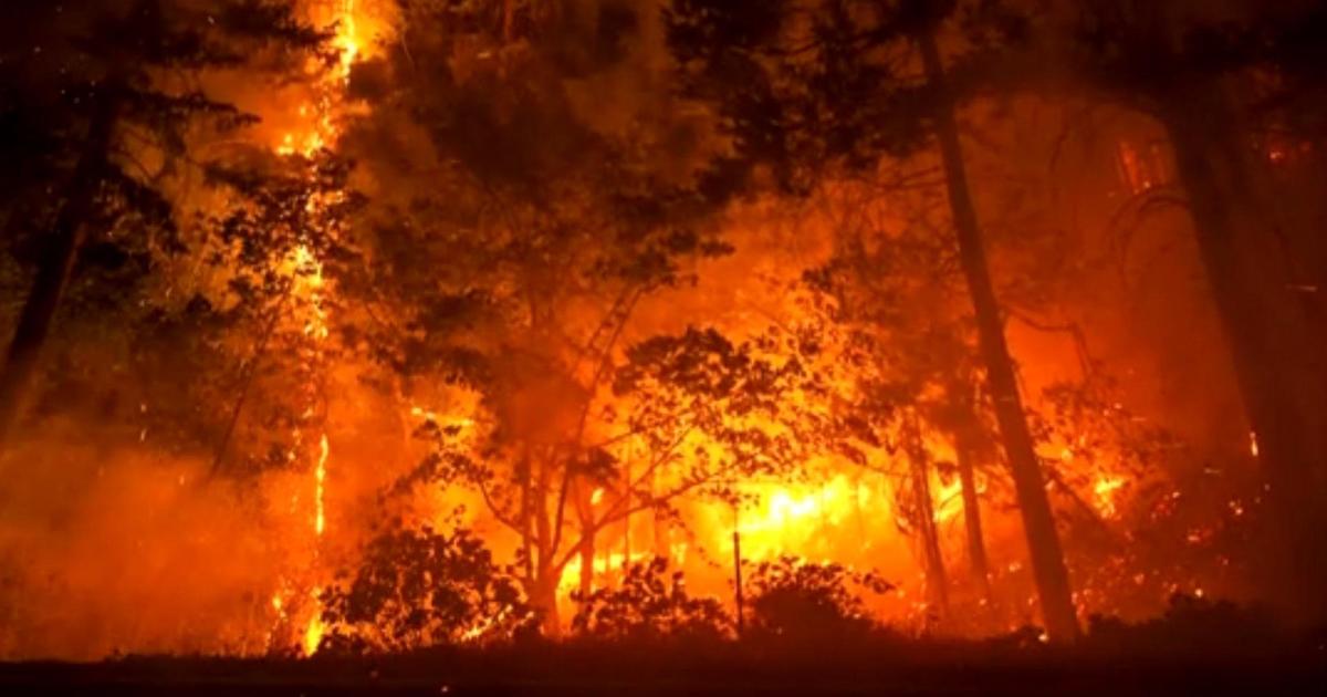 Crews battle large wildfires across western U.S.