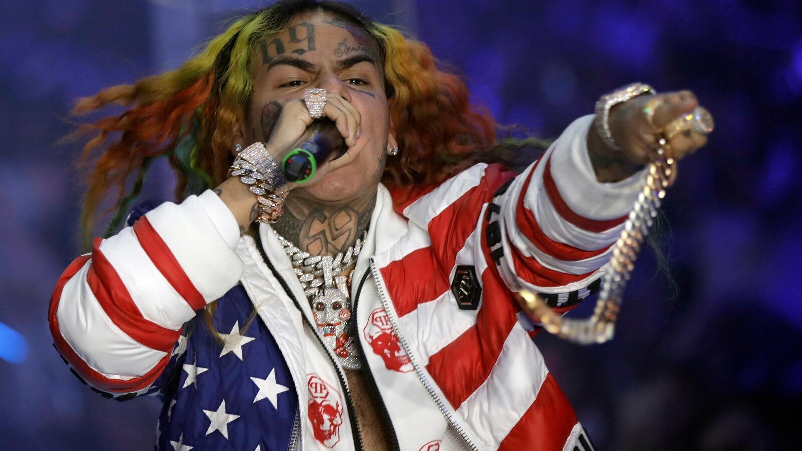 Rapper Tekashi 6ix9ine is arrested in New York for a possible parole violation